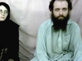This still image made from a 2013 video released by the Coleman family shows Caitlan Coleman and her husband, Canadian Joshua Boyle in a militant video given to the family. The couple and their three children were released last week after being held captive in Afghanistan for five years. (Coleman family via AP)