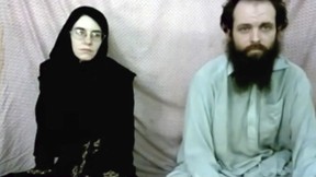 This still image made from a 2013 video released by the Coleman family shows Caitlan Coleman and her husband, Joshua Boyle in a militant video given to the family. The couple and their three children were released in October 2017 after being held captive in Afghanistan for five years. (Coleman family via AP)