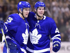 Toronto Maple Leafs defenceman Nikita Zaitsev celebrates his goal with teammate Calle Rosen during NHL action on Oct. 9, 2017. (THE CANADIAN PRESS/Frank Gunn)