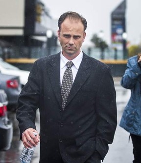 Toronto Police Sgt. Christopher Heard, seen here leaving court during an earlier appearance, had his two sex assault charges dismissed on Wednesday, Oct. 25, 2017. (file photo)