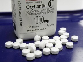 This Feb. 19, 2013 file photo shows OxyContin pills arranged for a photo at a pharmacy in Montpelier, Vt.