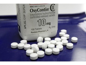 This Feb. 19, 2013 file photo shows OxyContin pills arranged for a photo at a pharmacy in Montpelier, Vt.