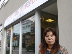 Pets Wonderful owner Diane Dai, who is closing her business because of losses from shoplifting, is seen here out front of her shop at Church and Charles Sts. on Tuesday, Oct. 24, 2017. (Chris Doucette/Toronto Sun)