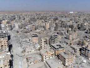 This Thursday, Oct. 19, 2017 frame grab made from drone video shows damaged buildings in Raqqa, Syria two days after Syrian Democratic Forces said that military operations to oust the Islamic State group have ended and that their fighters have taken full control of the city. (AP Photo/ Gabriel Chaim)