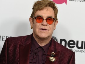 In this March 25, 2017 file photo, Elton John arrives at Elton John's 70th Birthday and 50-Year Songwriting Partnership with Bernie Taupin celebration in Los Angeles. John announced Monday, Oct. 16, 2017, that his show, "The Million Dollar Piano" at Caesars Palace in Las Vegas will be ending in May 2018 after more than 200 performances. (Photo by Jordan Strauss/Invision/AP, File)