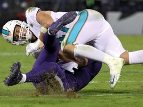 Baltimore Ravens' quarterback Joe Flacco is tackled by Miami Dolphins' middle linebacker Kiko Alonso of the during the second quarter at M&T Bank Stadium on Oct. 26, 2017 in Baltimore, Md. (Photo by Patrick Smith/Getty Images)