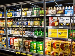In this stock photo, a store's beer cooler is filled with beverages.