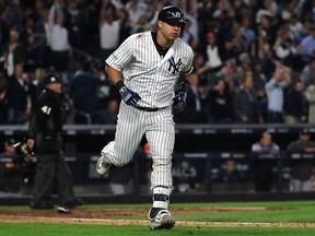 Gary Sanchez of the New York Yankees rounds the bases after hitting a solo home run during the seventh inning against the Houston Astros in Game 5 of the American League Championship Series at Yankee Stadium on Oct. 18, 2017. (Elsa/Getty Images)