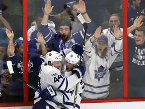 Toronto Maple Leafs centre Auston Matthews (34) celebrates his goal with teammate defenceman Morgan Rielly (44) during third period NHL hockey against the Ottawa Senators in Ottawa on Saturday, October 21, 2017. (THE CANADIAN PRESS/Fred Chartrand)