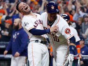 Jose Altuve and Yuli Gurriel of the Houston Astros celebrate during Game 5 (Getty)