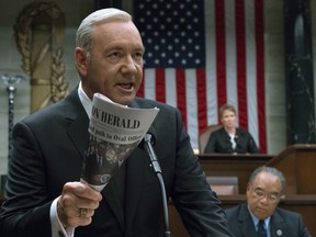 This image released by Netflix shows Kevin Spacey in a scene from "House Of Cards." Netflix says it's suspending production on "House of Cards" following harassment allegations against Spacey.