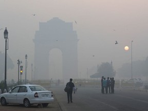 Delhi's landmark India Gate, a war memorial, is seen engulfed in morning smog a day after Diwali festival, in New Delhi, India, Friday, Oct. 20, 2017.