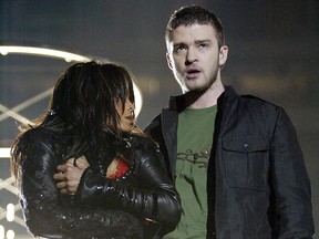 Singers Janet Jackson and surprise guest Justin Timberlake perform during the halftime show at Super Bowl XXXVIII between the New England Patriots and the Carolina Panthers at Reliant Stadium on Feb. 1, 2004 in Houston, Texas. At the end of the performance, Timberlake tore away a piece of Jackson's outfit. (Photo by Frank Micelotta/Getty Images)