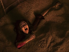 This image released by Lionsgate shows Laura Vandervoort in the horror film, "Jigsaw." (Brooke Palmer/Lionsgate via AP)