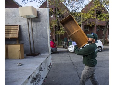 Jeremy Borda, of JUSTJUNK, clears out various thing no longer needed from a home in Toronto, Ont. on Wednesday October 25, 2017.