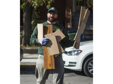 Jeremy Borda, of JUSTJUNK, clears out various thing no longer needed from a home in Toronto, Ont. on Wednesday October 25, 2017.