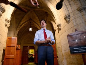 Prime Minister Justin Trudeau speaks to media before a special caucus meeting on Parliament Hill, in Ottawa on Monday, Oct. 16, 2017. (Sean Kilpatrick/The Canadian Press)