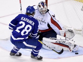 Washington Capitals goalie Braden Holtby (70) makes a save on Toronto Maple Leafs right wing Kasperi Kapanen (28) during second period NHL hockey round one playoff action in Toronto on Wednesday, April 19, 2017.