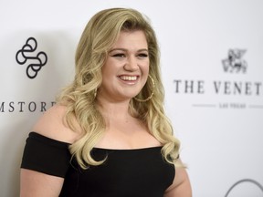 Kelly Clarkson arrives at Variety's Power of Women Luncheon at the Beverly Wilshire hotel in Beverly Hills, Calif., on Oct. 13, 2017. (Jordan Strauss/Invision/AP)
