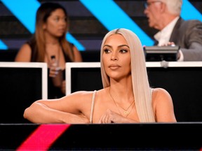 In this handout photo provided by One Voice: Somos Live!, Kim Kardashian participates in the phone bank onstage during 'One Voice: Somos Live! A Concert For Disaster Relief' at the Universal Studios Lot on October 14, 2017 in Los Angeles, California. (Photo by Kevin Mazur/One Voice: Somos Live!/Getty Images)