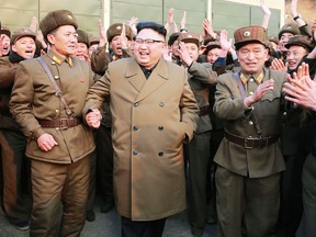 This undated picture released from North Korea's official Korean Central News Agency (KCNA) on March 19, 2017 shows North Korean leader Kim Jong-Un (C) inspecting the ground jet test of newly developed high-thrust engine at the Sohae Satellite Launching Ground in North Korea.