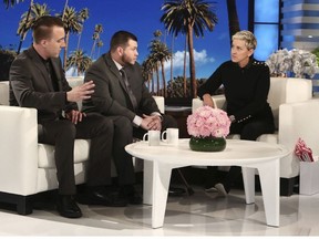 In this Oct. 17, 2017, photo released by Warner Bros., Stephen Schuck, left, and Jesus Campos appear with host Ellen Degeneres during a taping of "The Ellen DeGeneres Show" at the Warner Bros. lot in Burbank, Calif.