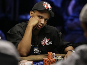 In this July 15, 2009 file photo, Phil Ivey looks up during the World Series of Poker at the Rio Hotel and Casino in Las Vegas.