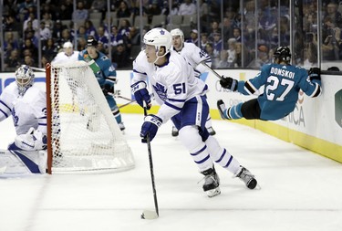 Toronto Maple Leafs' Jake Gardiner (51) controls the puck against the San Jose Sharks during the second period of an NHL hockey game Monday, Oct. 30, 2017, in San Jose, Calif. (AP Photo/Marcio Jose Sanchez) ORG XMIT: SJA113