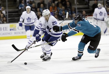 Toronto Maple Leafs' William Nylander (29) is defended by San Jose Sharks' Justin Braun during the third period of an NHL hockey game Monday, Oct. 30, 2017, in San Jose, Calif. (AP Photo/Marcio Jose Sanchez) ORG XMIT: SJA116