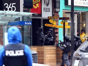 Toronto Police and ETF respond to a gun call near Blue Jays Way on King St. W. at a marijuana dispensary in Toronto on Thursday October 26, 2017.