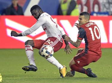 New York Red Bulls defender Kemar Lawrence (92) and Toronto FC forward Sebastian Giovinco (10) vie for the ball during the second half of an MLS Eastern Conference semifinal soccer match Monday, Oct. 30, 2017, in Harrison, N.J. Toronto FC won 2-1. (AP Photo/Bill Kostroun) ORG XMIT: NJBK109 ORG XMIT: POS1710302102001051