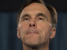 Minister of Finance Bill Morneau speaks with the media before Question Period on Parliament Hill, in Ottawa on Thursday, October 19, 2017. (THE CANADIAN PRESS/Adrian Wyld)