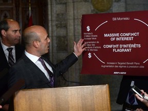 NDP MP Nathan Cullen, right, and NDP Parliamentary Leader Guy Caron take part in a press conference in the foyer of the House of Commons on Parliament Hill, in Ottawa on Tuesday, October 17, 2017.