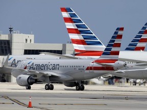 In this Wednesday, May 27, 2015, file photo, an American Airlines jet taxis to the gate at Miami International Airport, in Miami.