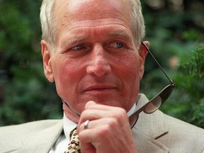 Paul Newman poses for photographers in the streets of Paris, 23 August 1989. The Newman couple were in Paris for the shooting of James Ivory's film 'Mr. and Mrs. Bridges'. (Photo credit should read JEAN-PIERRE MULLER/AFP/Getty Images)