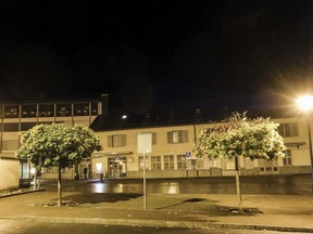 This photo shows a town square in Flums, Switzerland, Sunday, Oct. 22, 2017, after several were injured in an ax attack. Police believe the suspect attacked several people in the town square, then fled with a stolen car, which later was involved in an accident. The suspect continued on foot before attacking more people at a gas station shop, where he was arrested, police said. (Eddy Risch/Keystone via AP)