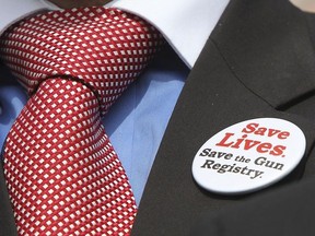 A pro long-gun registry pin is seen on the jacket of Liberal MP Mark Holland Wednesday Sept 22, 2010 in Ottawa.