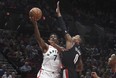 Toronto Raptors guard Kyle Lowry drives to the basket on Portland Trail Blazers guard Damian Lillard during the first quarter of an NBA basketball game in Portland, Ore., Monday, Oct. 30,  (AP Photo/Steve Dykes)