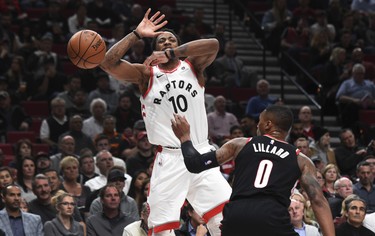 Portland Trail Blazers guard Damian Lillard knocks the ball away from Toronto Raptors guard DeMar DeRozan during the first quarter of an NBA basketball game in Portland, Ore., Monday, Oct. 30, 2017. (AP Photo/Steve Dykes) ORG XMIT: ORSD103