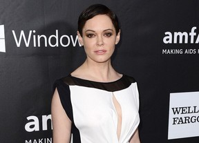 In this Oct. 29, 2014 file photo, Rose McGowan arrives at the amfAR Inspiration Gala in Los Angeles. McGowan is scheduled to address The Women's Convention in Detroit. An arrest warrant has been obtained for McGowan for felony possession of a controlled substance. The felony charge stems from a police investigation of personal belongings left behind on a United flight arriving at Washington Dulles International Airport on Jan. 20.