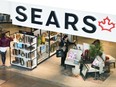 Shoppers enter and leave a Sears retail store in Toronto on Thursday, Oct. 19, 2017. THE CANADIAN PRESS/Nathan Denette