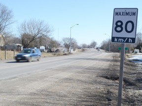 An 80 km/h sign is posted on an Ontario road.