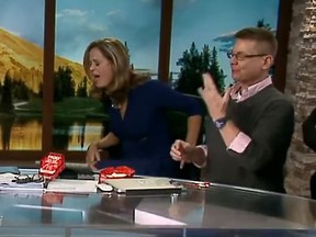 Channel 2 Daybreak anchor Natalie Tysdal (left) prepares to vomit after eating the world's spiciest chip while on air Wednesday morning. (Facebook/Channel 2 Daybreak)