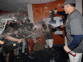 Houston Astros' Jose Altuve is sprayed with champagne after Game 7 of baseball's American League Championship Series against the New York Yankees Saturday, Oct. 21, 2017, in Houston. The Astros won 4-0 to win the series. (AP Photo/David J. Phillip)