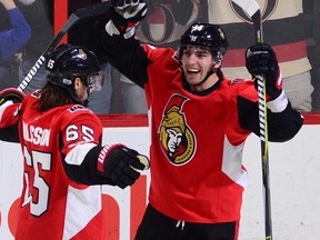 Ottawa Senators right wing Alexandre Burrows, right, celebrates a goal with teammate Erik Karlsson as they take on the New Jersey Devils during second period NHL action in Ottawa on Oct. 19, 2017.  (SEAN KILPATRICK/The Canadian Press)