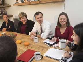Minister of Finance Bill Morneau speaks with, from left to right, Rebecca Evans, co-owner of Station 33 Cafe & Yoga, Alaina Lockhart, MP in the riding of Fundy Royal; Angie Cummings, President of Sussex sleep clinic Inc.; and Status of Women Minister Maryam Monsef at Station 33 Cafe & Yoga in Hampton, N.B., on Wednesday, October 18, 2017.