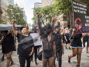People from the Blacks Lives Matter movement march during the Pride parade in Toronto, Sunday, June 25, 2017.
