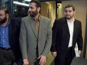Abdullah Almalki, right to left, Muayyed Nureddin and Ahmad El-Maati arrive at a news conference in Ottawa Tuesday Oct.21, 2008. Three Canadians who were tortured in Syria have received a total of $31 million in federal compensation. THE CANADIAN PRESS/Adrian Wyld