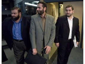 Abdullah Almalki, right to left, Muayyed Nureddin and Ahmad El-Maati arrive at a news conference in Ottawa Tuesday Oct.21, 2008.
