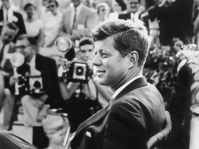 This handout photo provided by the Newseum, and the estate of Jacques Lowe, shows John F. Kennedy at a news conference in Omaha, Neb. in 1959.